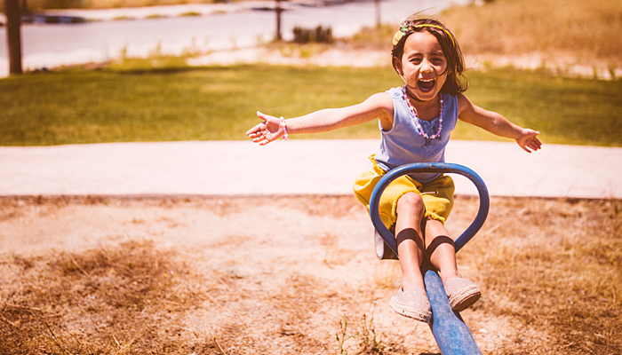 TeeterTotter2 Little Girl On One Side Of A Teeter-Totter