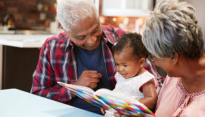 Grandparents reading to child