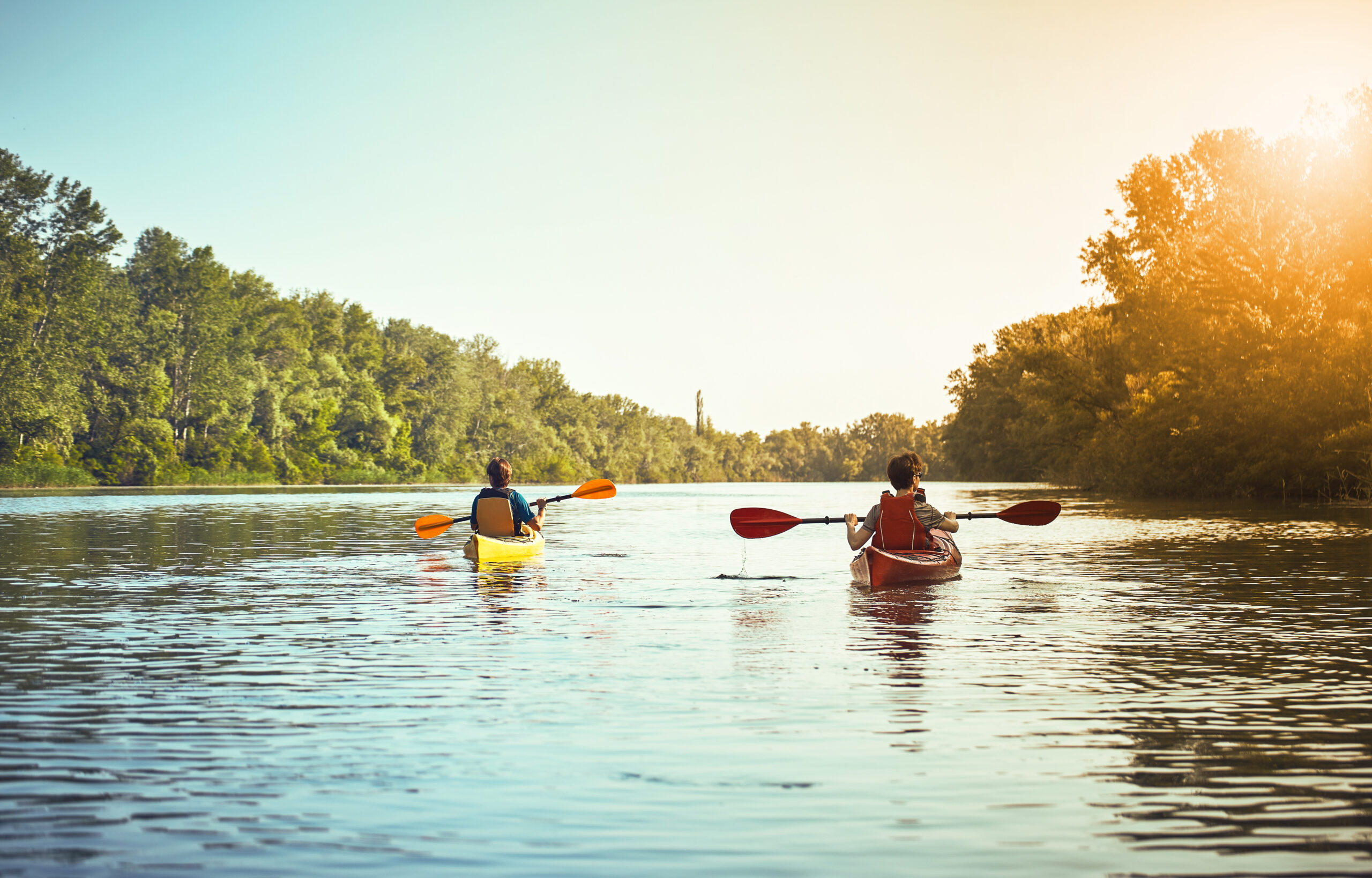 A canoe trip on the river in the summer. Couple Painting House
